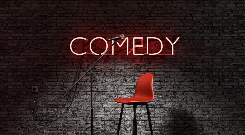Comedy stage with neon sign